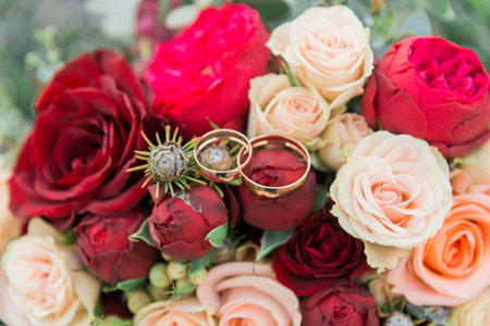 Bouquet of flowers. The bride's bouquet. Bridal bouquet. Floristics. Wedding rings. Wedding bouquet from different colors.の写真素材