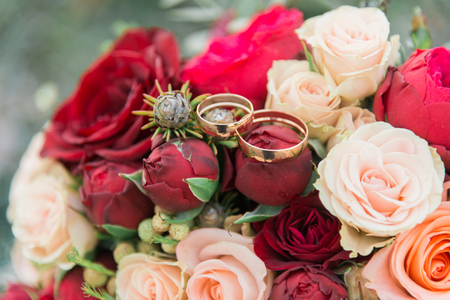 Bouquet of flowers. The bride's bouquet. Bridal bouquet. Floristics. Wedding rings. Wedding bouquet from different colors.の写真素材