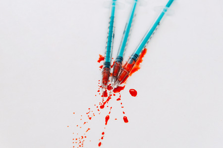 Treatment against addiction. Syringe with blood. Immunodeficiency. Treatment of addictionの写真素材