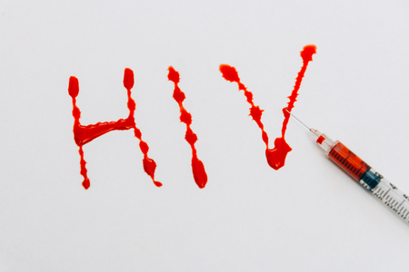 Treatment against addiction. Syringe with blood. Immunodeficiency. Treatment of addictionの写真素材