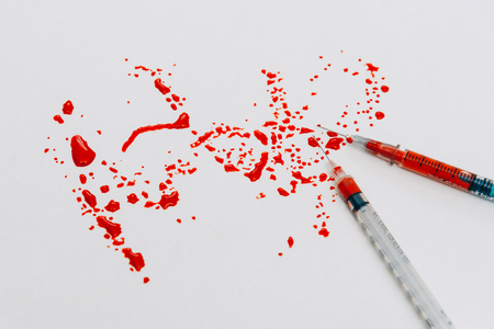 Treatment against addiction. Syringe with blood. Immunodeficiency. Treatment of addictionの写真素材