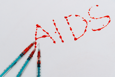 Treatment against addiction. Syringe with blood. Immunodeficiency. Treatment of addictionの写真素材