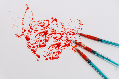 Treatment against addiction. Syringe with blood. Immunodeficiency. Treatment of addictionの写真素材
