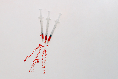 Treatment against addiction. Syringe with blood. Immunodeficiency. Treatment of addictionの写真素材