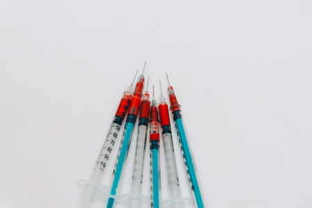 Treatment against addiction. Syringe with blood. Immunodeficiency. Treatment of addictionの写真素材