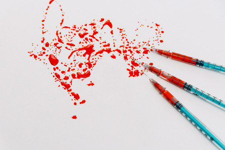 Treatment against addiction. Syringe with blood. Immunodeficiency. Treatment of addictionの写真素材