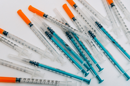 Treatment against addiction. Vaccination of people. Insulin injection. Diabetesの写真素材
