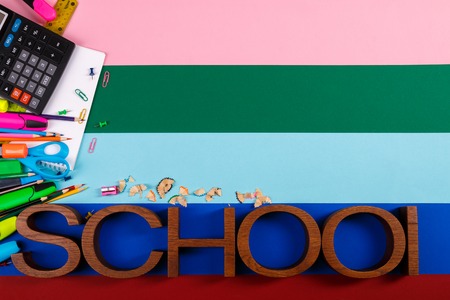 School or office stationery on colorful background. Back to School. Frame, copy space. Top view. supplies. inscriptionの写真素材