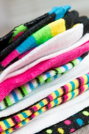 Colorful socks on grey wooden background. styleの写真素材