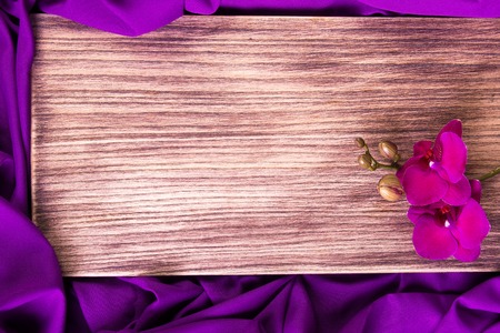 Purple orchid on wooden background. Copy space. Greeting card. Spring. Woman Day. 8 march.の写真素材