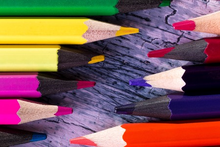 Set of color pencils on wooden background. Macro.の写真素材