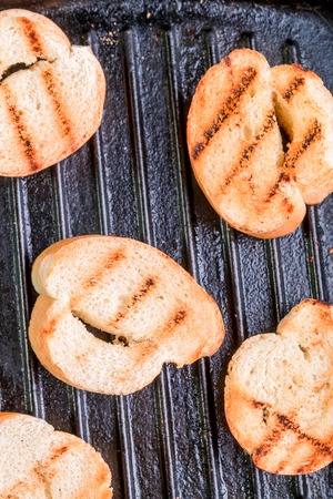 Grilled toast on pan. Top view.の写真素材