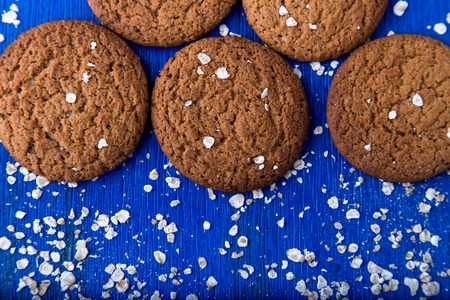 Oatmeal cookies on blue backround. Top view.  Copy spaceの写真素材