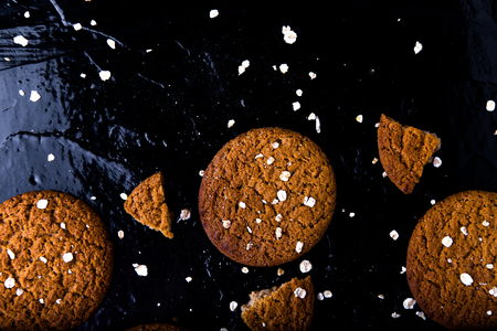 Oatmeal cookies on black background.  Top view