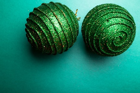 Christmas ball on green pepper backround.Christmas greeting card. Merry Christmas. Top view. Copy space. Minimalism conceptの写真素材