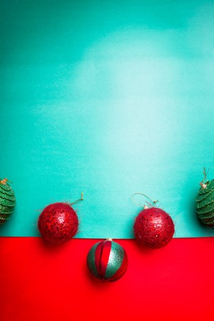 Christmas ball on green and red pepper backround.Christmas greeting card. Merry Christmas. Top view. Copy space. Minimalism conceptの写真素材