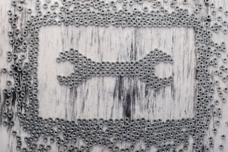 Nut wrench from metal nuts background. Flat layの写真素材