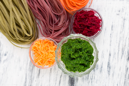 Colored Raw Vegetable Vegetarian Pasta with Beets, Carrots and Spinach. Ingredient for Prepare.の写真素材