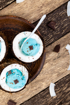 Blue ice cream in coconut bowl.の写真素材