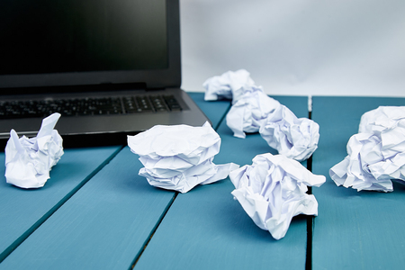 Concept in search ideas. Creased paper of idea. Modern workplace with notebook or laptop. Still life, business, office supplies or education concept. Flat lay. Top view.の写真素材