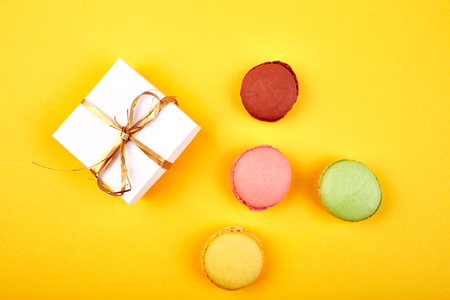 Sweet Dessert Macaron or macaroon, colorful almond cookies, cakes. Greeting card. Presents or Gifts. Woman or Mother Day. Spring. Flat lay. Copy space. Minimalismの写真素材