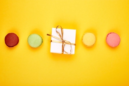 Sweet Dessert Macaron or macaroon, colorful almond cookies, cakes. Greeting card. Presents or Gifts. Woman or Mother Day. Spring. Flat lay. Copy space. Minimalismの写真素材