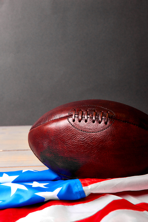 American football ball and old glory flag. Copy space. USa. Patriotic. の写真素材