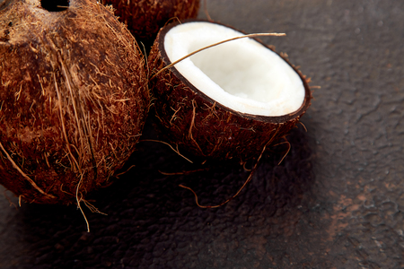 Fresh Coconut on brown background. Flat lay. Copy space, Food concept. Still lifeの写真素材