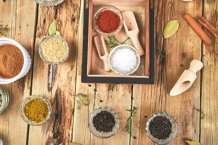 Flat lay of Seasoning background. Spice and herb seasoning with fresh and dried herbs and spices in bowls. Colourful various herbs and spices for cooking on wooden rustic background. Top view.の写真素材