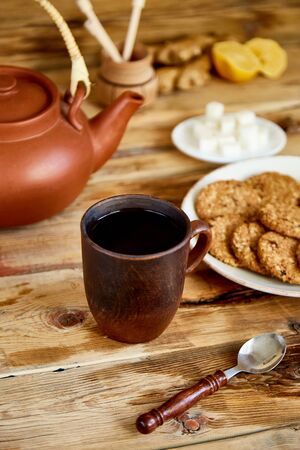 Afternoon tea, Tea Ceremony, Teapot Honey Cups of tea with cookies, biscuits on Old Rustic wooden Table Background.の写真素材