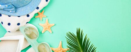 Banner with Colorful summer female fashion outfit. Sunhat, white flip flops, polka dot towel,...