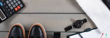Banner with Businessman, work outfit. White shirt with black tie, watch, belt, oxford shoes, planchette and calculator. Back to work. Copy space, frame. Set of mans fashion and accessories.の写真素材