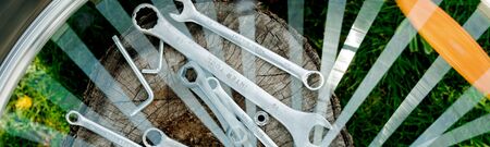 Banner of Bicycle repair. Tools, instrument for repairing bike on the wooden stump