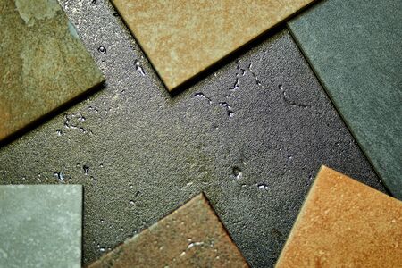 Frame of various decorative tiles samples. Colorful samples of a stone tile in store. Copy space....