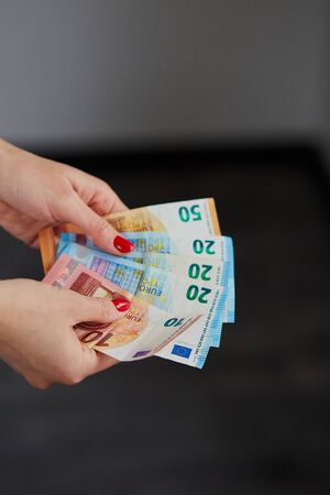 Woman hands counting euro money. Business, finance, saving, banking and people concept.
