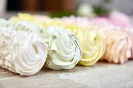 Sweet homemade marshmallow, background from multicolor pastel zephyr, top view, copy space. Flat lay.の写真素材