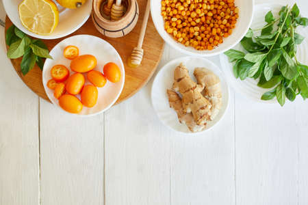 Trendy virus protection food, immunity concept. Fall immune system booste vitamin health on wooden white background, Flat lay , top view, copy space.の写真素材