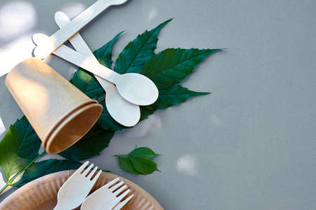 Flat lay of eco craft paper and wooden tableware, Zero waste, plastic-free and eco-friendly living, paper cups, dishes,plates and wooden cutleryrecycling or eco-friendly concept.の写真素材