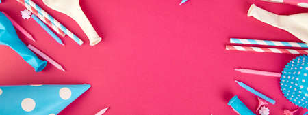 Banner of Celebration Flat lay. Party pink and blue hat polka dot background. Birthday paper hat,...