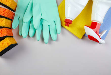Flat lay of variety house cleaning product on grey table with copy space, cleaning set for different surfaces, Detergents service concept, Top view.の写真素材