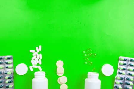 Flat lay of pills, fish oil, vitamins on yellow background, Healthcare concept, healthy food, supplements for healthy good life, Immune booster.の写真素材