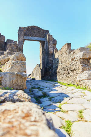 Archaeological ruins of ancient Roman city, Pompei, Looking South down one of the many streets in Pompeii, Campania region, Italyの写真素材
