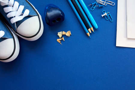 Blue Flat lay Back to school concept, School and office supplies on with copy space. Lots of different stationery items on colorful backgroundの写真素材