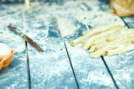 Closeup process making homemade pasta. Fresh dough for italian traditional pasta to thin ribbon. Italian cuisine recipe. Home cuisine.の写真素材