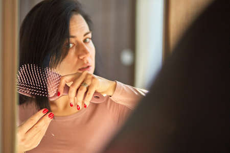 Problem hair loss concept, losing hair on hairbrushの写真素材