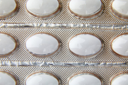 Flat lay macro blister capsule pills, tablets, top view