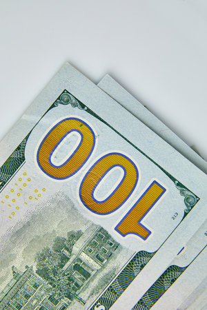 Flat lay Closeup on the bills for a US hundred dollar banknote, fragment of dollar bill, money...