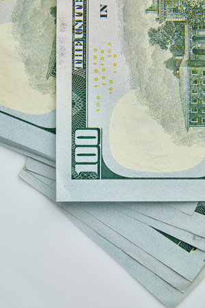 Flat lay Closeup on the bills for a US hundred dollar banknote, fragment of dollar bill, money...