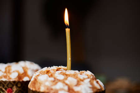 Happy Easter, The candle is burning in the Easter cake, The concept of preparing for the Easter...