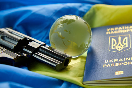 Flag of Ukraine, handgun, passport glass globe copy space, russia Ukraine war, Stop war, Freedom, independence countryの写真素材